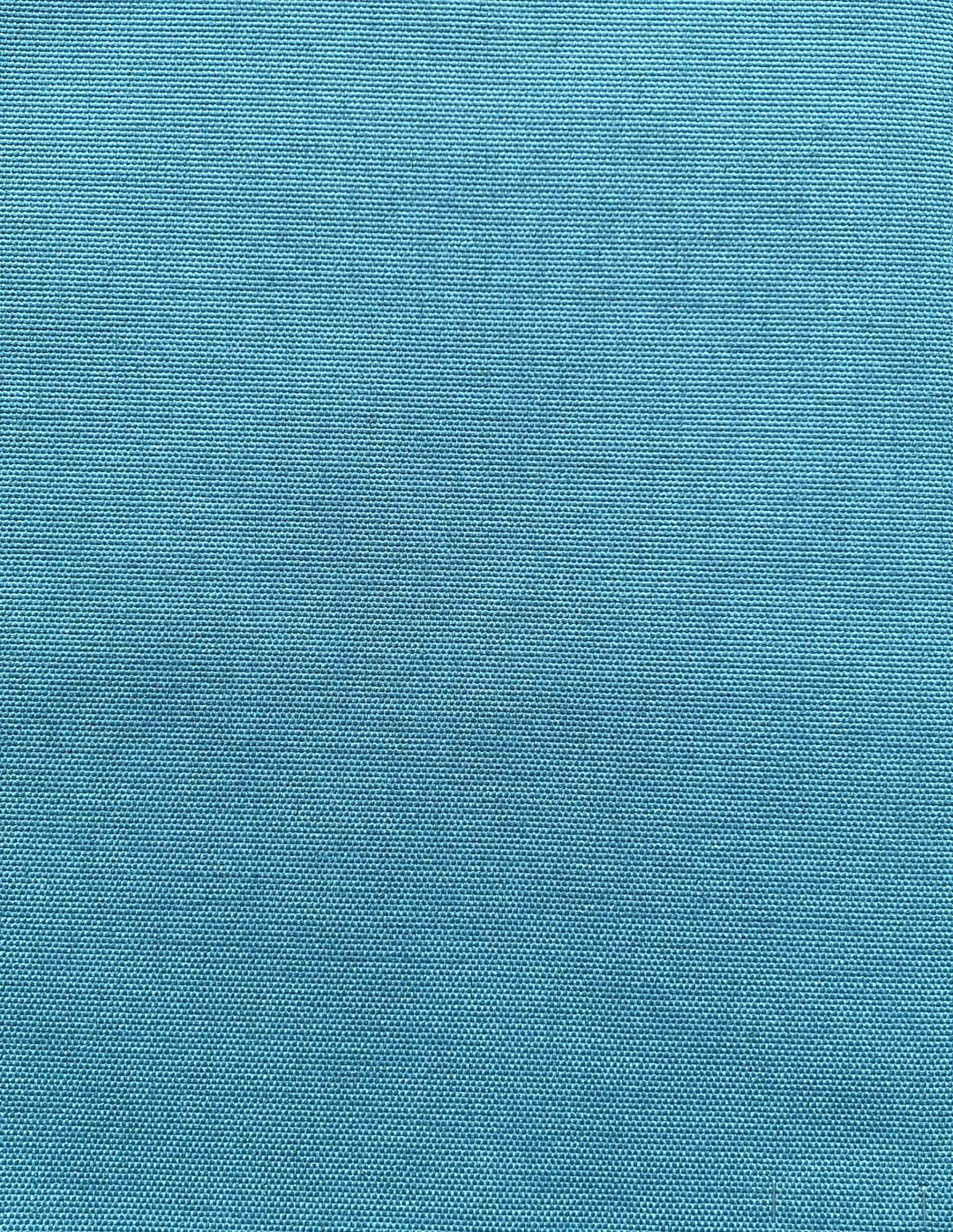 Tekstil i lys blå farve, produceret i Europa, med en jævn og struktureret overflade.