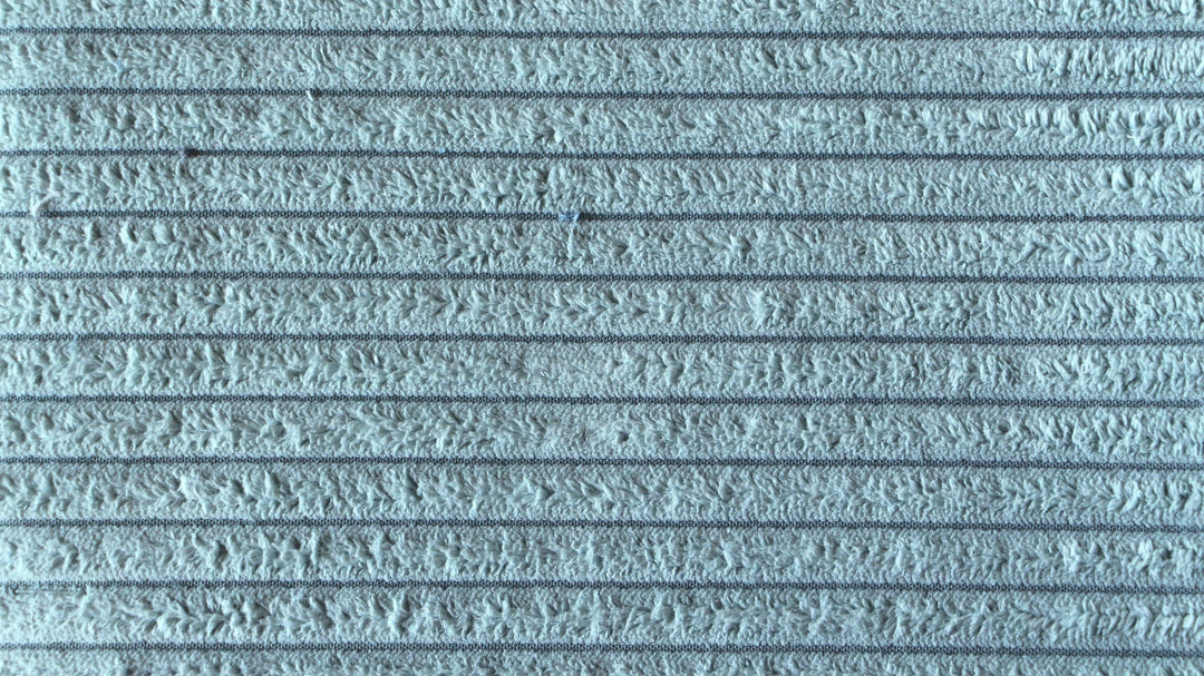 Tekstur af blå væg med striber og ujævn overflade, produceret i Europa.